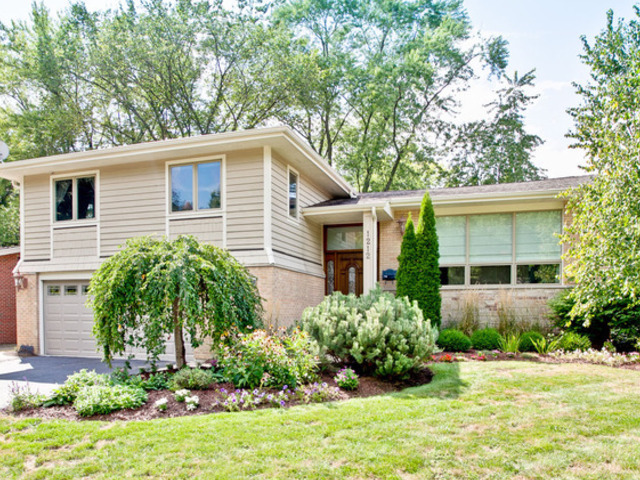 1212 Kenton Road Deerfield, IL 60015 - Photo 1 of 24 a front view of house with yard and green space