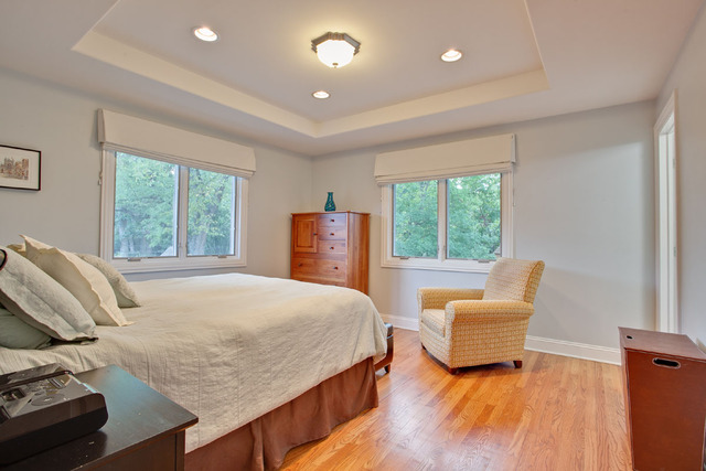 1212 Kenton Road Deerfield, IL 60015 - Photo 17 of 24 a bedroom with a bed and wooden floor
