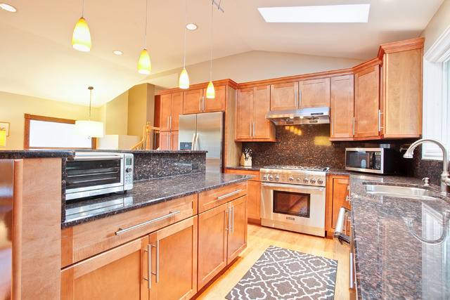 1212 Kenton Road Deerfield, IL 60015 - Photo 6 of 24 a kitchen with stainless steel appliances granite countertop a stove a sink and a microwave