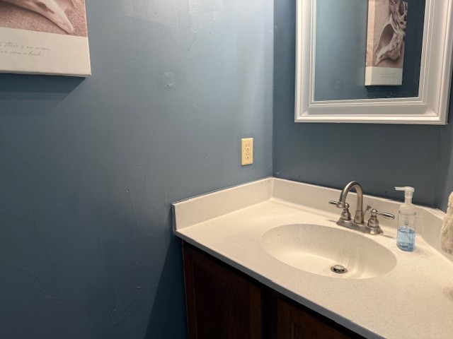 7130 Everhart Road, Unit 14 Corpus Christi, TX 78413 - Photo 5 of 8 a bathroom with a sink and a mirror