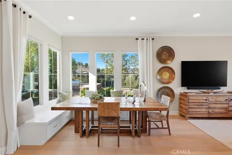 a living room with furniture and view of kitchen
