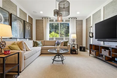 a bedroom with a bed and a chair