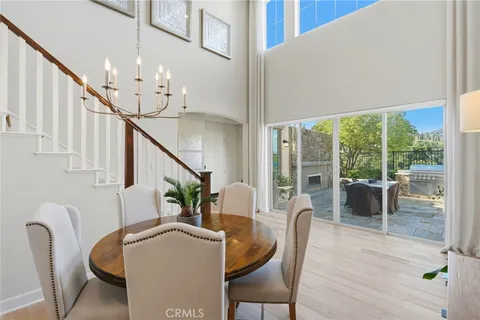 a view of a dining room and hall with wooden floor