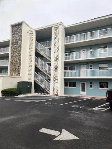 a front view of a building with a street