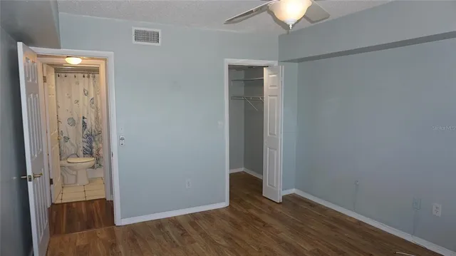 a bathroom with a toilet and shower