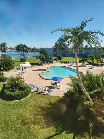 a view of a lake with a yard