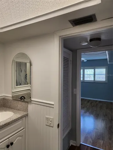 a kitchen with a sink and a refrigerator