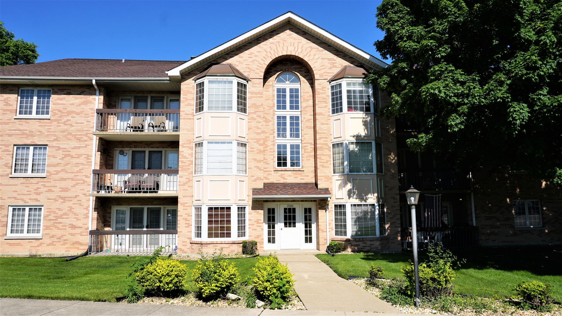 2161 Oak Road, Unit 1C Homewood, IL 60430 - Photo 1 of 17 front view of a house with a yard