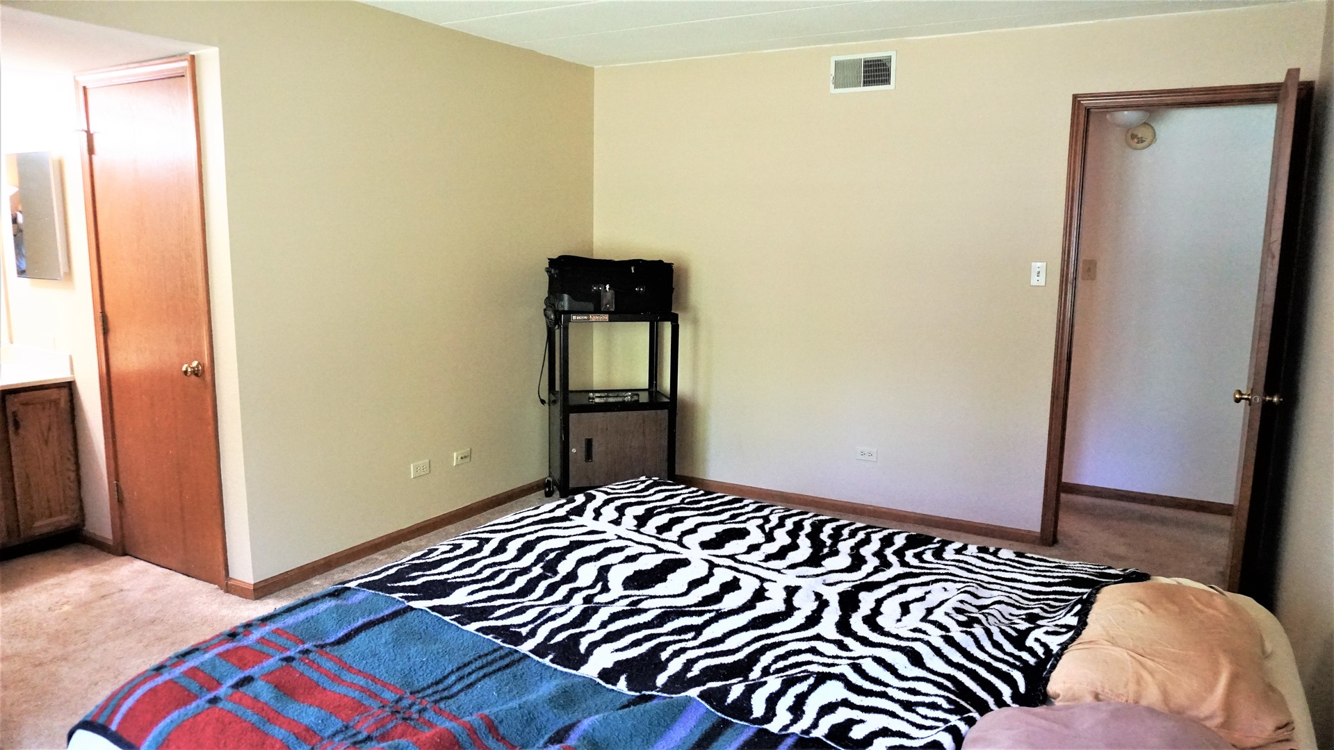 2161 Oak Road, Unit 1C Homewood, IL 60430 - Photo 12 of 17 a bedroom with a bed and wooden floor