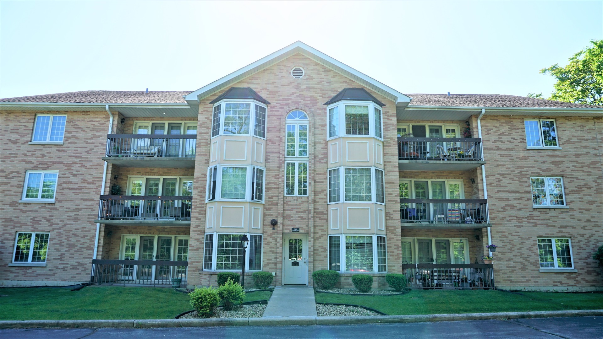 2161 Oak Road, Unit 1C Homewood, IL 60430 - Photo 17 of 17 front view of a brick house with a yard