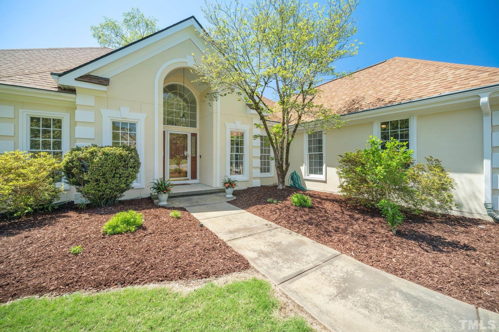 7801 Hogan Drive Wake Forest, NC 27587 - Photo 11 of 51 a front view of a house with garden