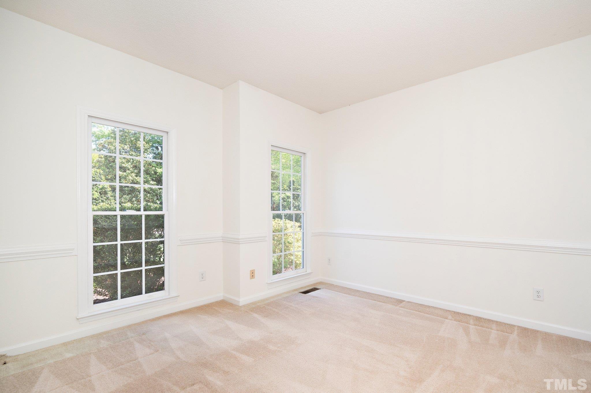 7801 Hogan Drive Wake Forest, NC 27587 - Photo 13 of 51 an empty room with windows