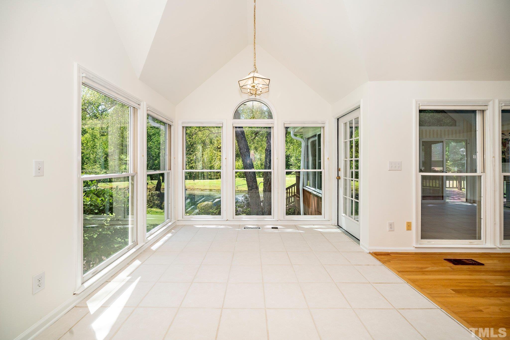 7801 Hogan Drive Wake Forest, NC 27587 - Photo 16 of 51 a view of an entryway with a garden