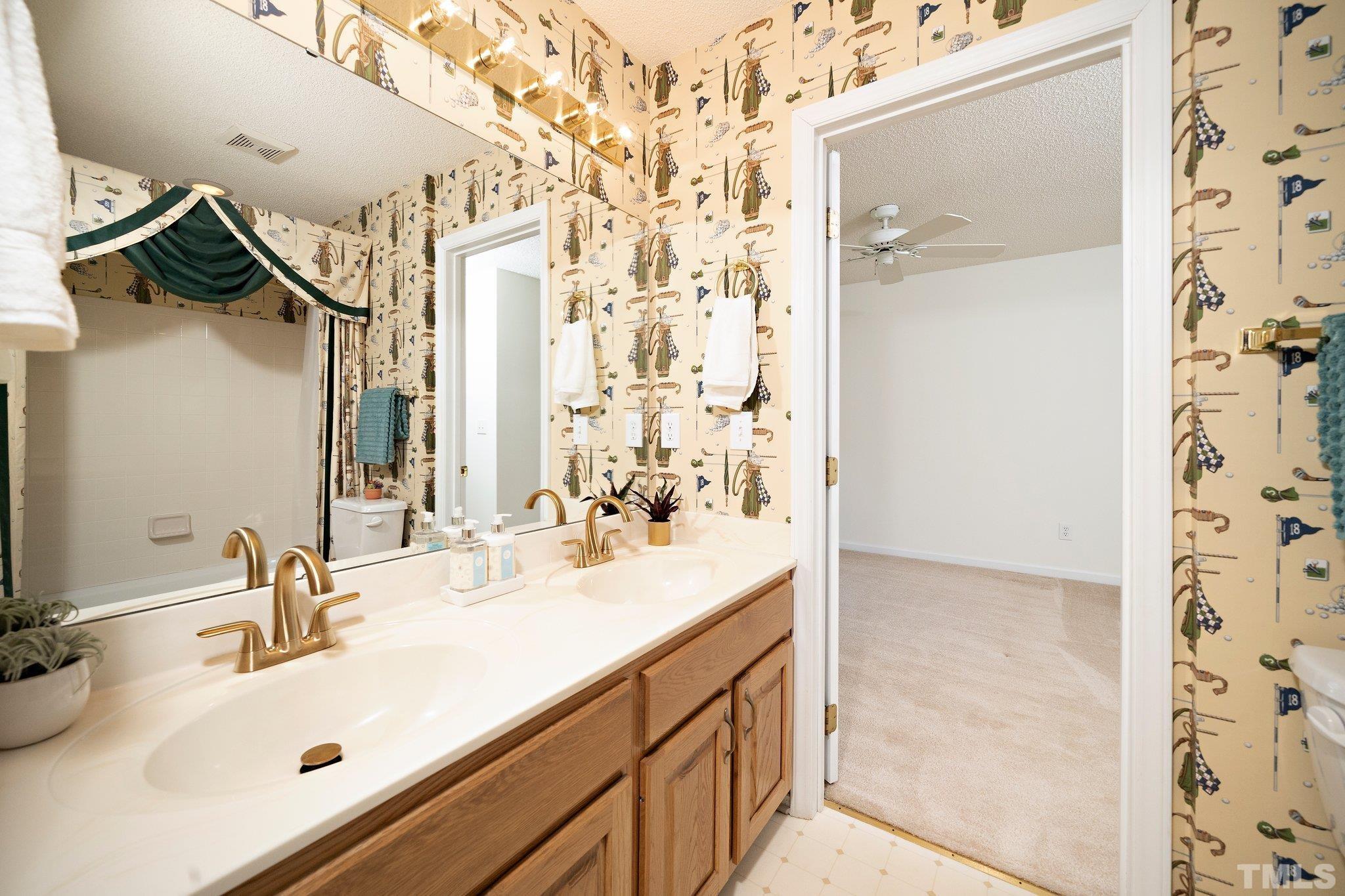 7801 Hogan Drive Wake Forest, NC 27587 - Photo 27 of 51 a bathroom with a sink and a mirror