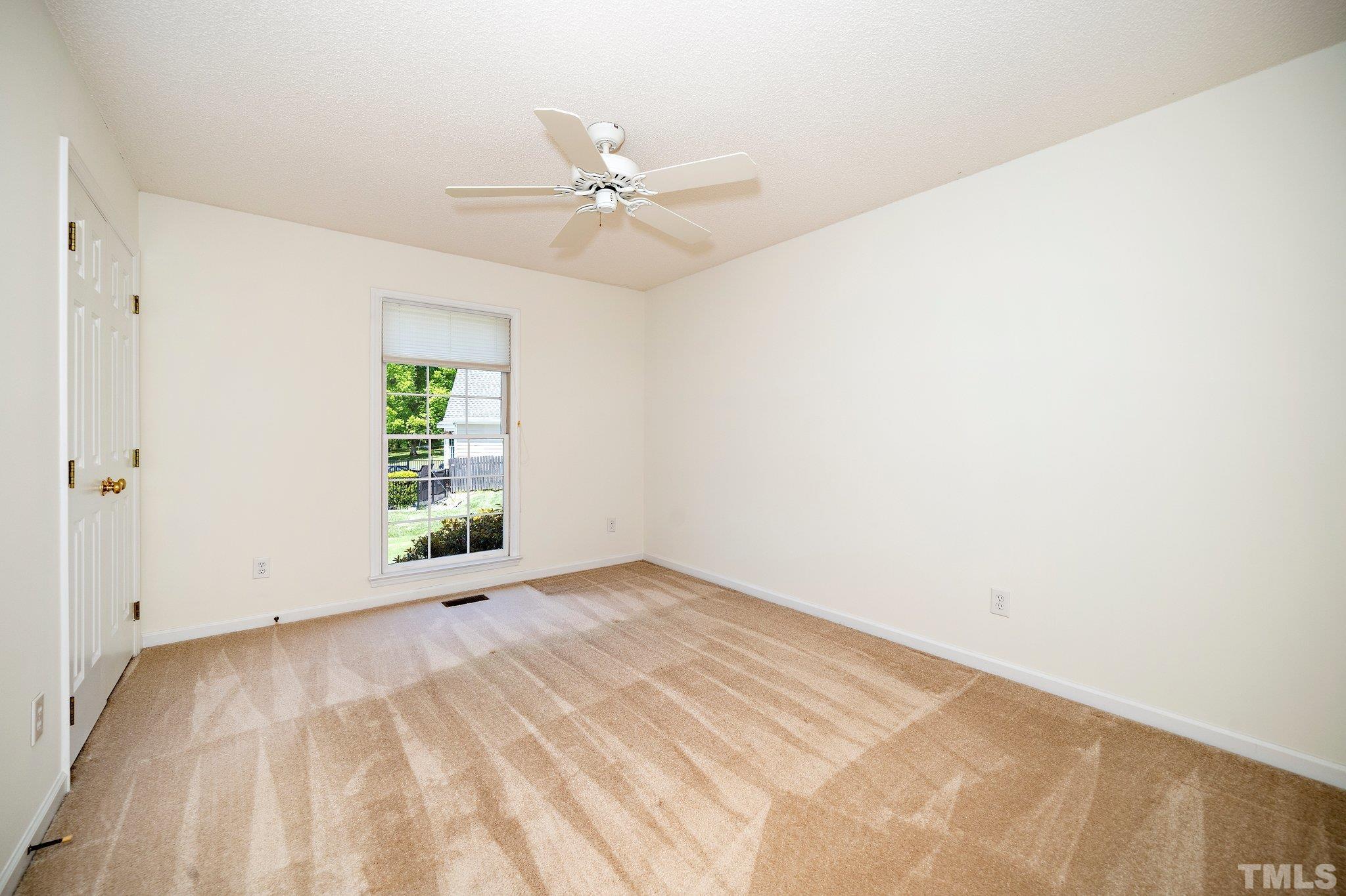 7801 Hogan Drive Wake Forest, NC 27587 - Photo 28 of 51 a view of an empty room with a window