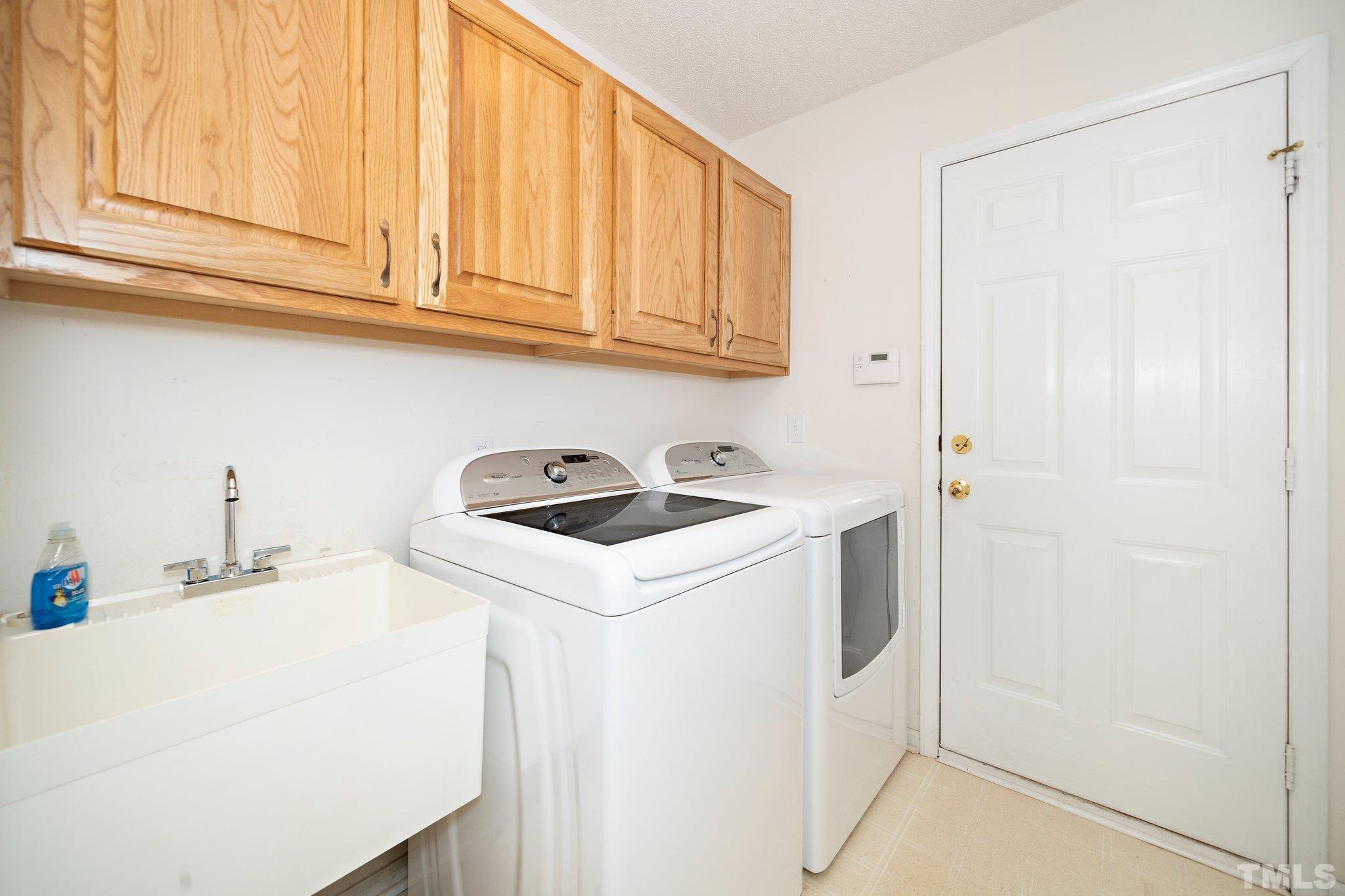 7801 Hogan Drive Wake Forest, NC 27587 - Photo 29 of 51 a utility room with dryer and washer