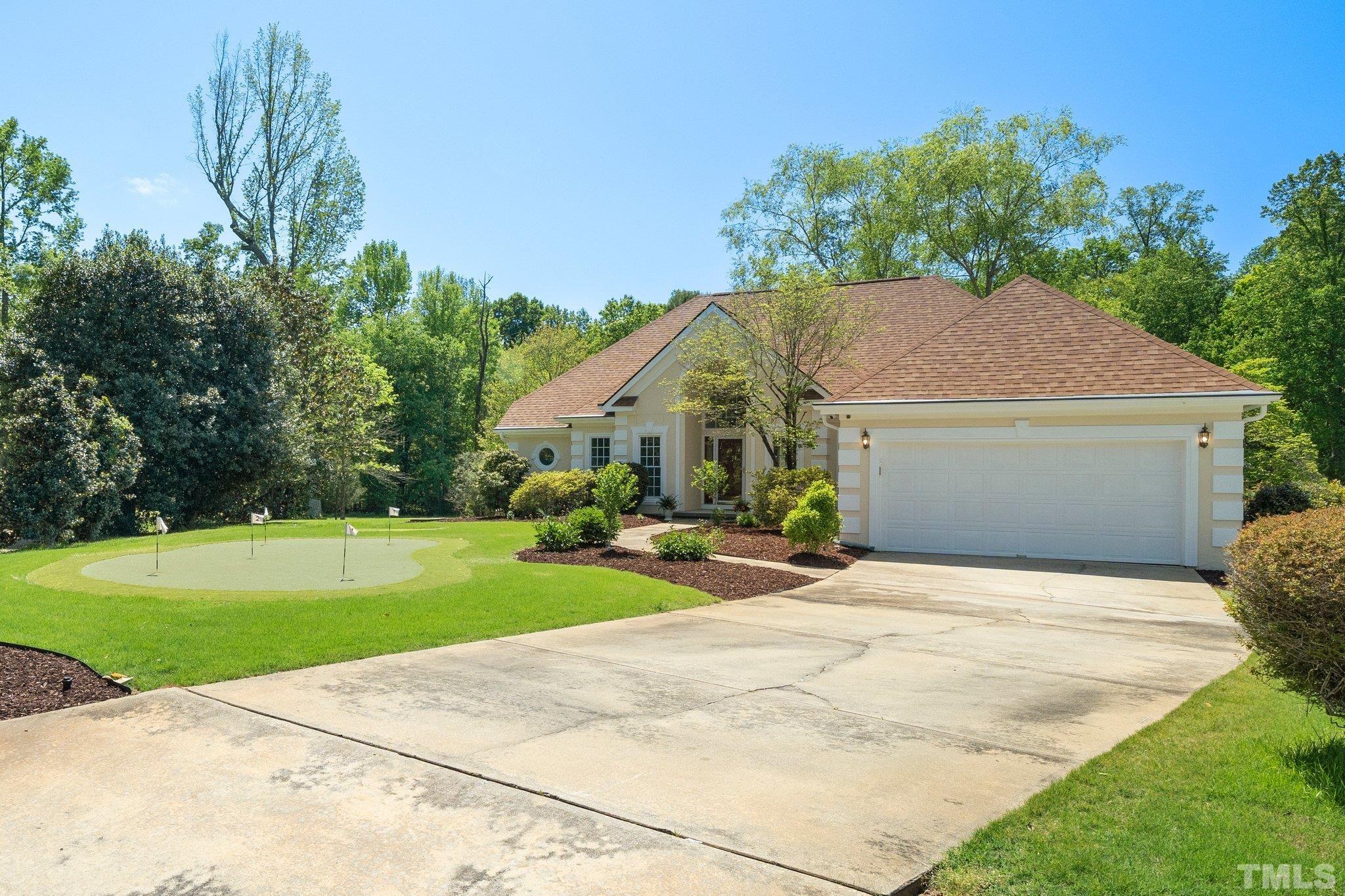 7801 Hogan Drive Wake Forest, NC 27587 - Photo 3 of 51 a house with garden in front of it