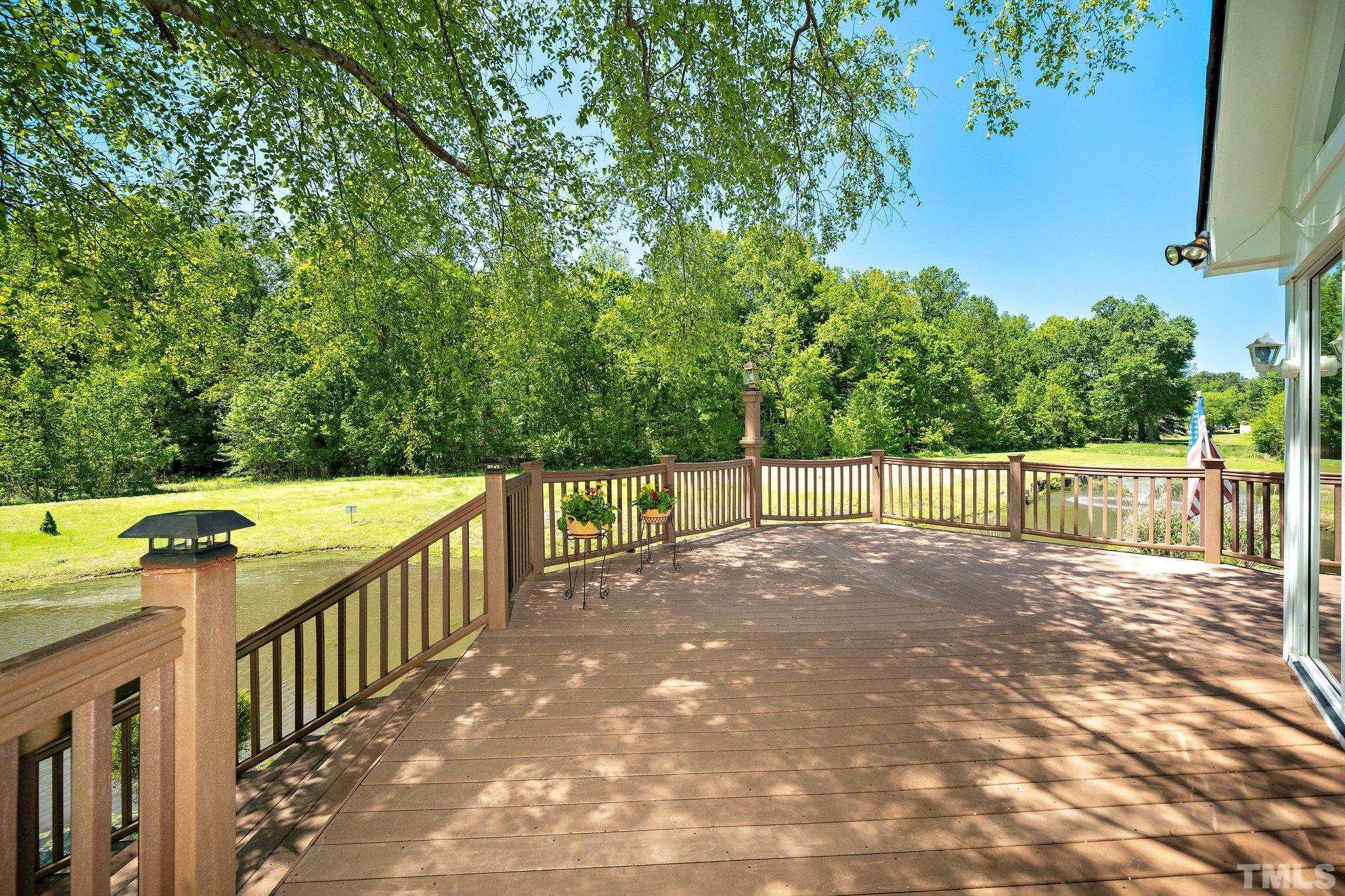 7801 Hogan Drive Wake Forest, NC 27587 - Photo 39 of 51 a view of a balcony with wooden fence