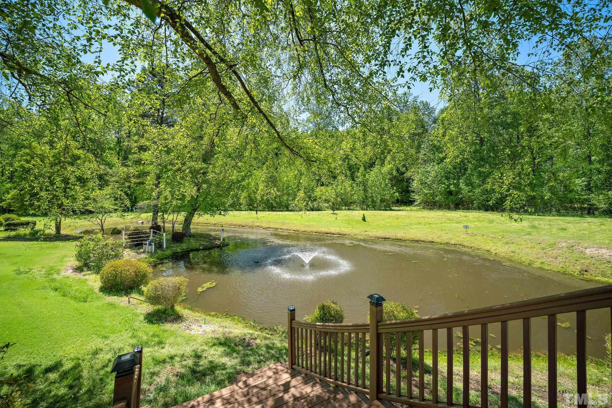 7801 Hogan Drive Wake Forest, NC 27587 - Photo 40 of 51 a view of a water with large trees