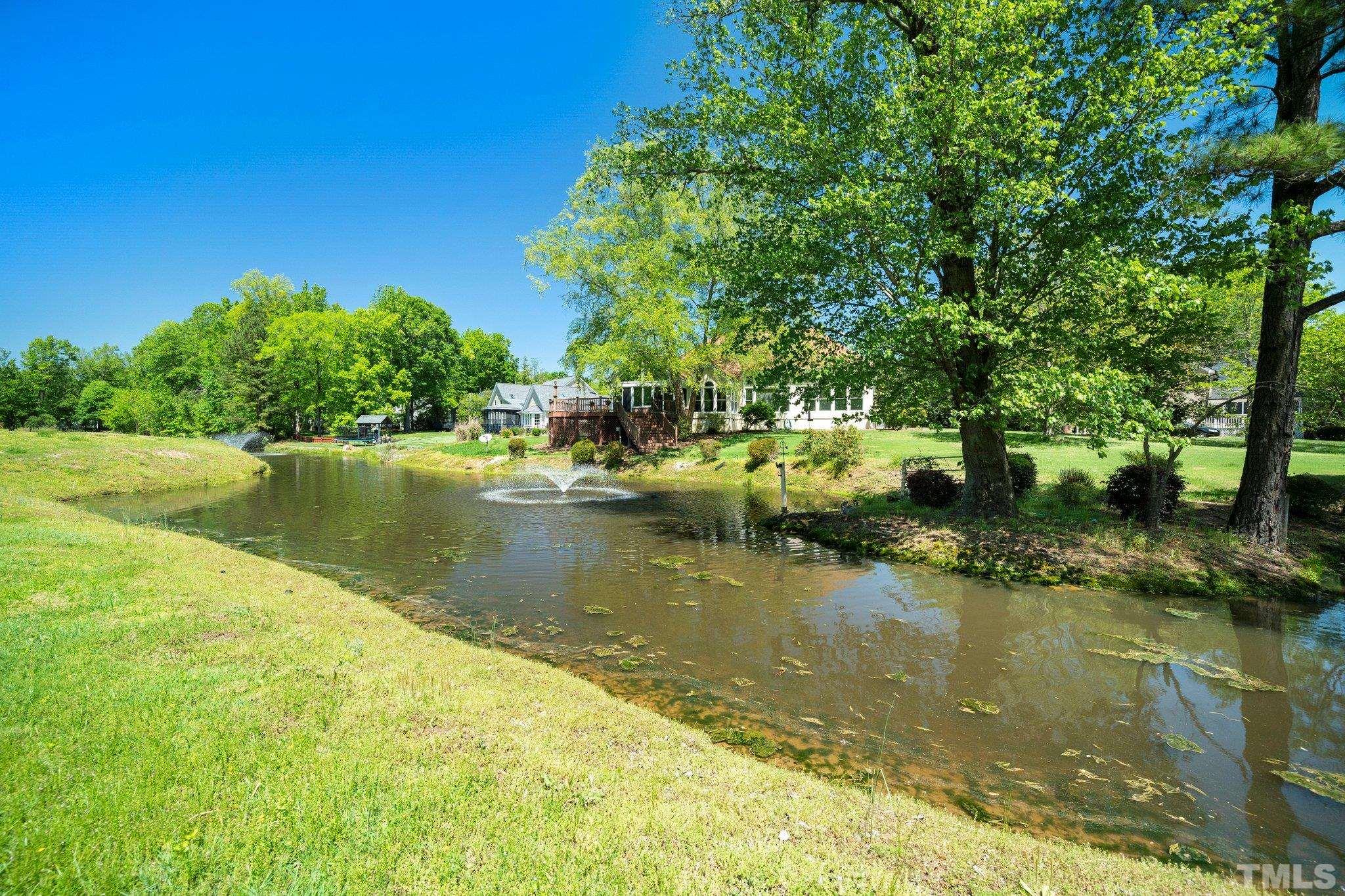 7801 Hogan Drive Wake Forest, NC 27587 - Photo 46 of 51 a view of a lake with houses in the background