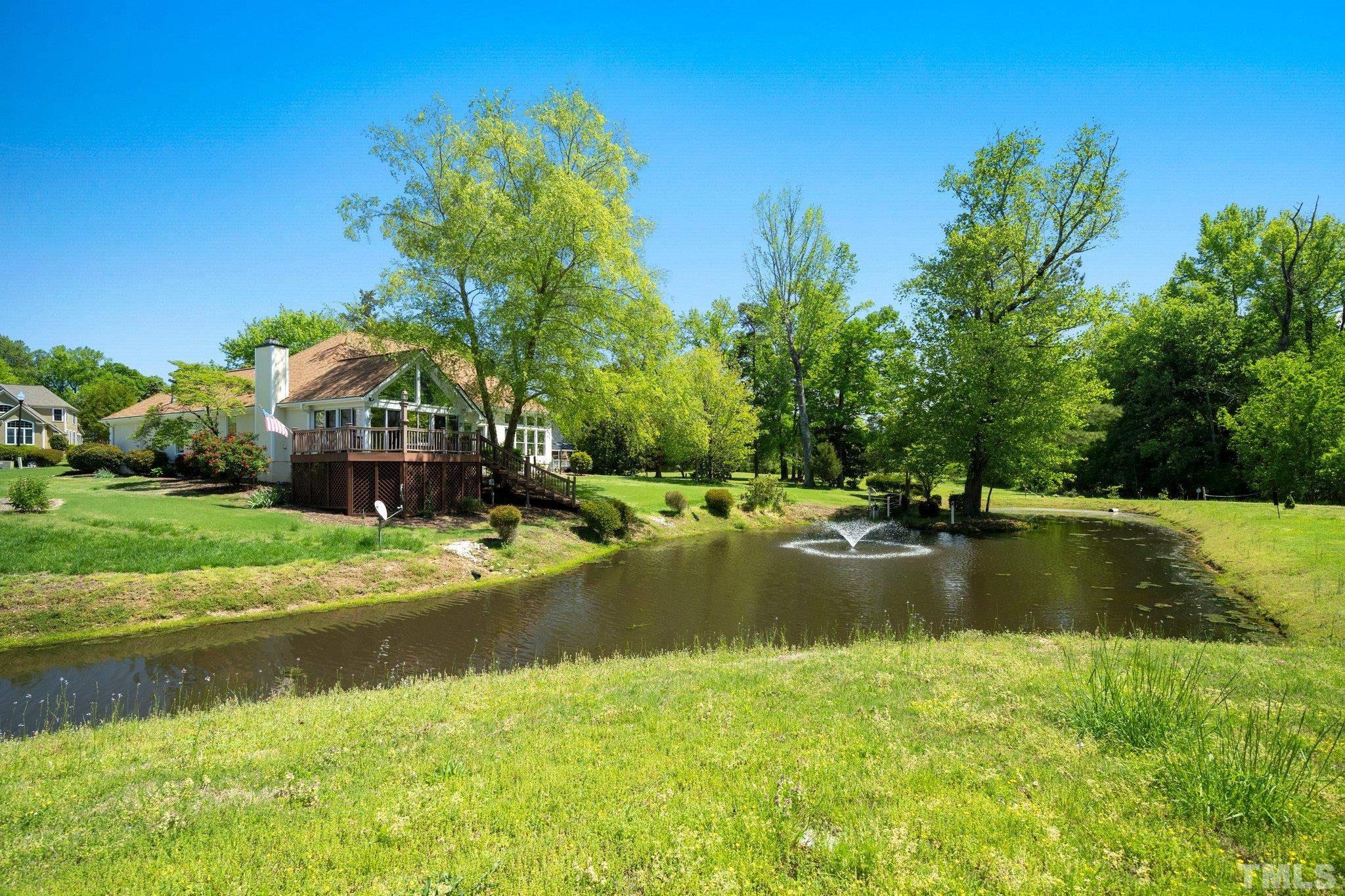 7801 Hogan Drive Wake Forest, NC 27587 - Photo 48 of 51 a view of swimming pool with a yard and large trees
