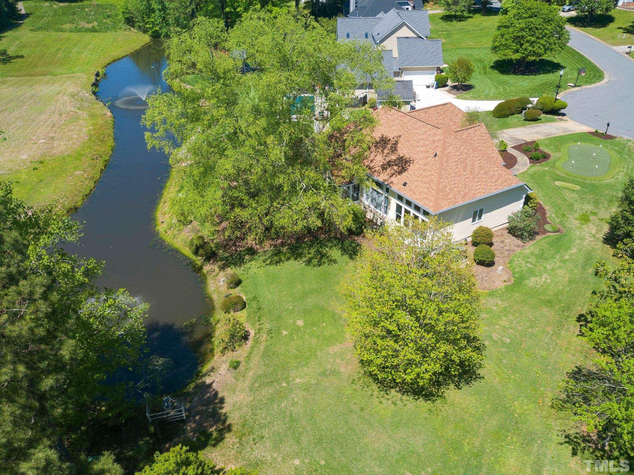 7801 Hogan Drive Wake Forest, NC 27587 - Photo 6 of 51 an aerial view of residential house with outdoor space and trees all around