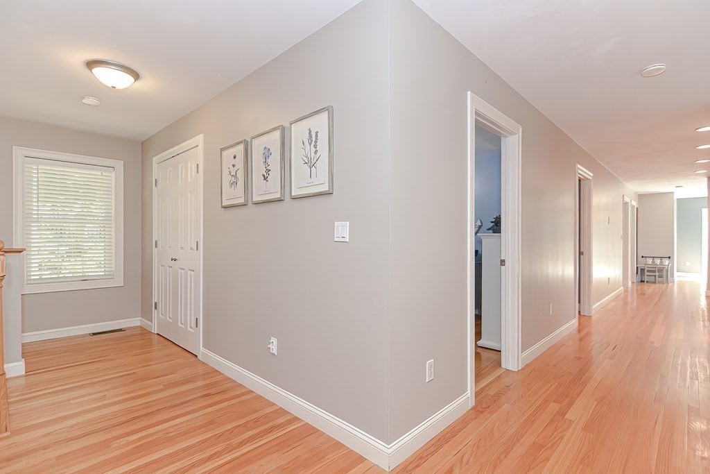 9 Broadway Stoneham, MA 02180 - Photo 28 of 42 a view of a hallway with wooden floor