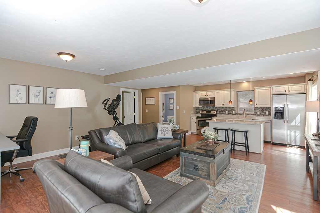 9 Broadway Stoneham, MA 02180 - Photo 34 of 42 a living room with furniture and view of kitchen
