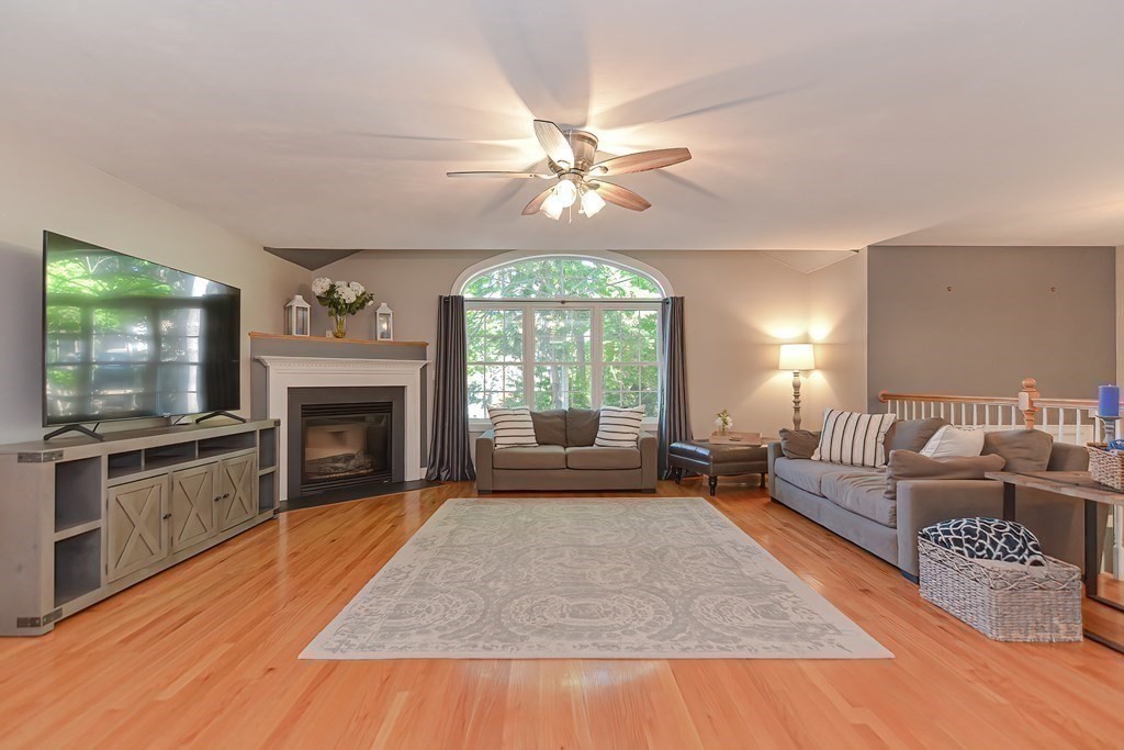 9 Broadway Stoneham, MA 02180 - Photo 8 of 42 a living room with furniture and a fireplace