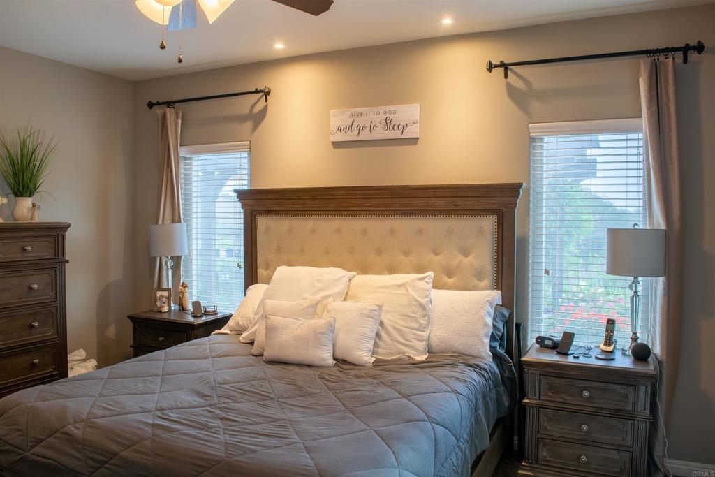2521 Ralls Street Fallbrook, CA 92028 - Photo 3 of 43 a large white bed in a bedroom next to a window