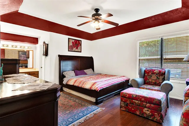 a bedroom with furniture and a window