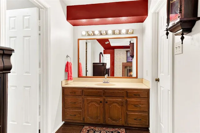 a bathroom with a sink and a mirror