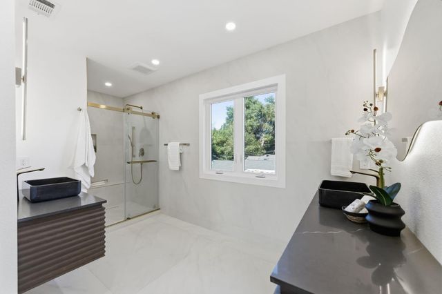 a view of hallway with furniture and a window
