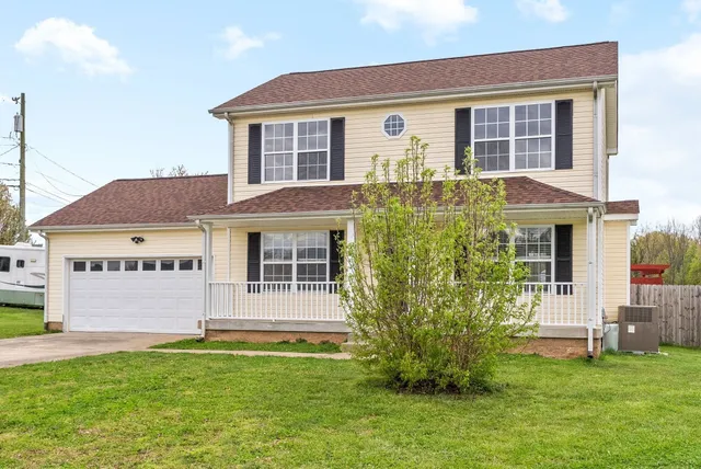 a front view of a house with a yard