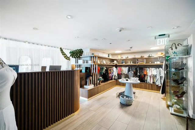 a living room with furniture a window and a lamp