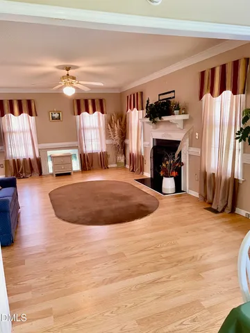 a view of water heater room with wooden floor