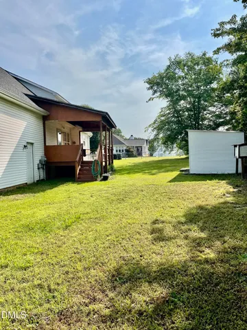 a view of a big yard with lots of green space and mountain view