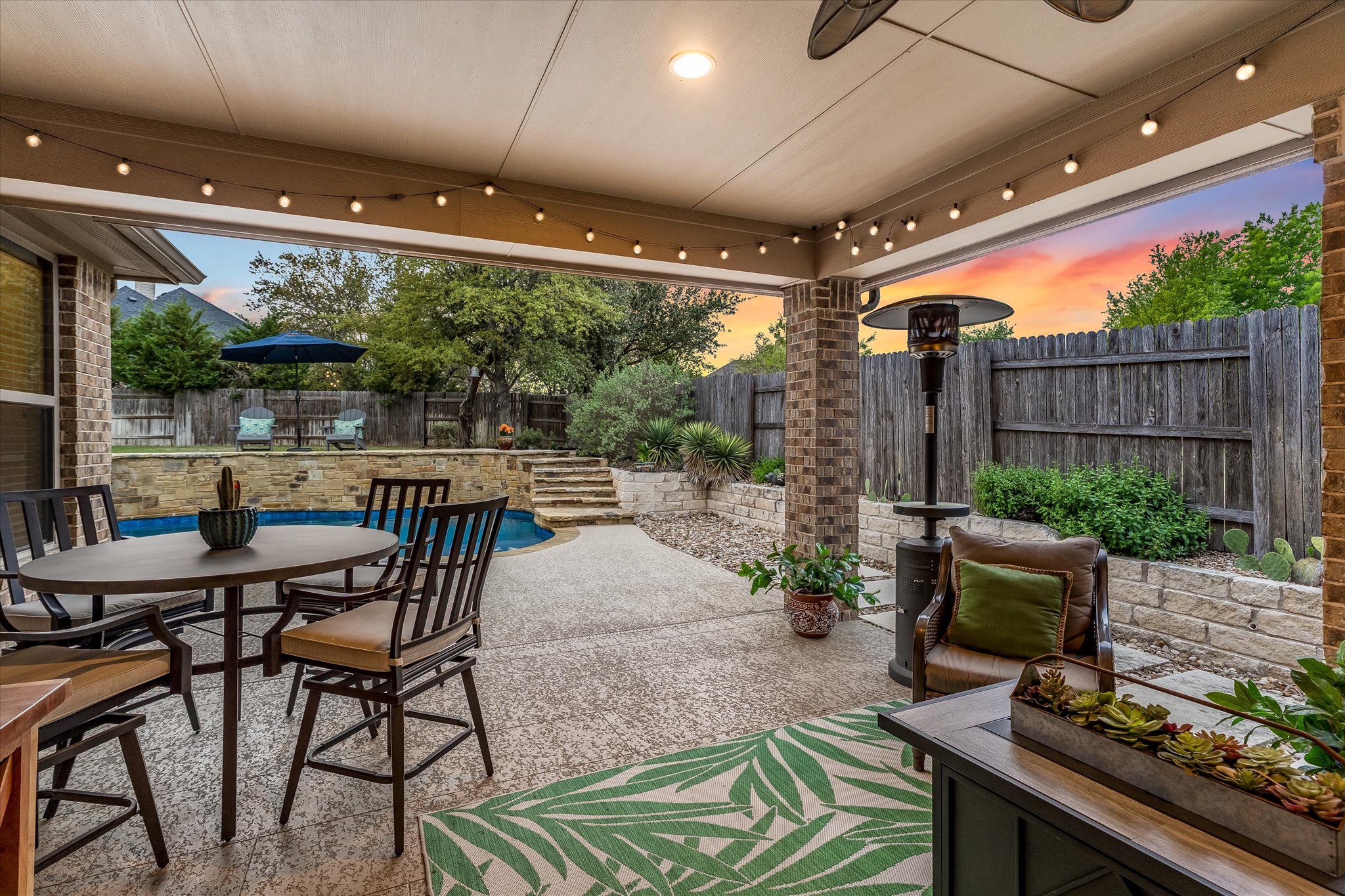 226 Galloway Lane Austin, TX 78737 - Photo 25 of 30 Fenced backyard with a patio and outdoor dining area