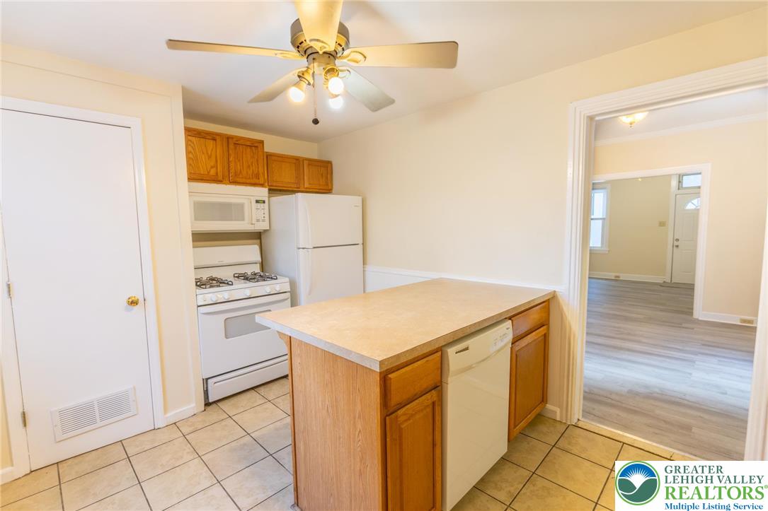 32 West Raspberry Street Bethlehem, PA 18018 - Photo 6 of 17 a kitchen with a stove a refrigerator and a cabinets