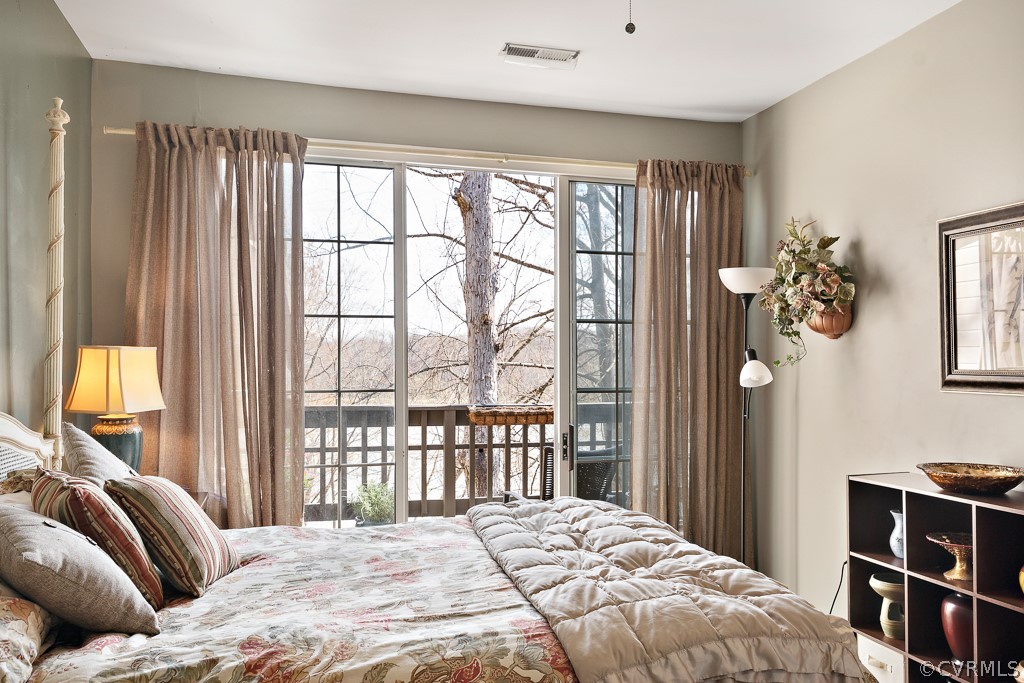 1767 Raintree Commons Drive Henrico, VA 23238 - Photo 20 of 27 a bedroom with a bed and a large window