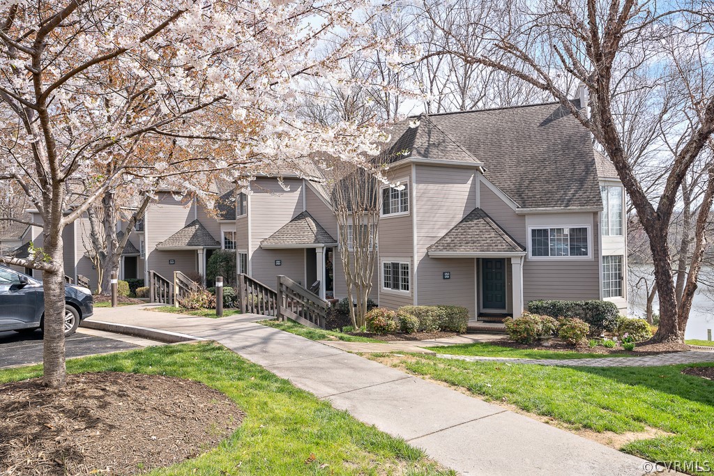 1767 Raintree Commons Drive Henrico, VA 23238 - Photo 2 of 27 a front view of a house with a yard and trees