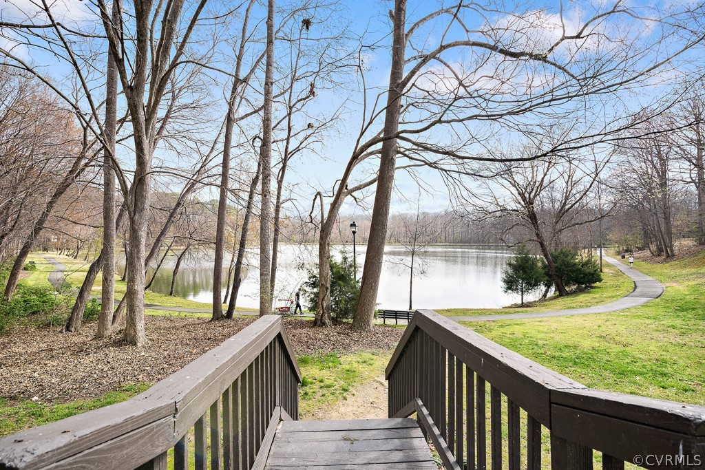 1767 Raintree Commons Drive Henrico, VA 23238 - Photo 24 of 27 a view of a pathway with a yard and wooden fence
