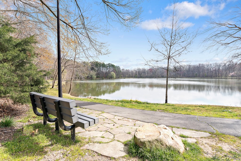 1767 Raintree Commons Drive Henrico, VA 23238 - Photo 25 of 27 a view of a lake with couches and wooden fence