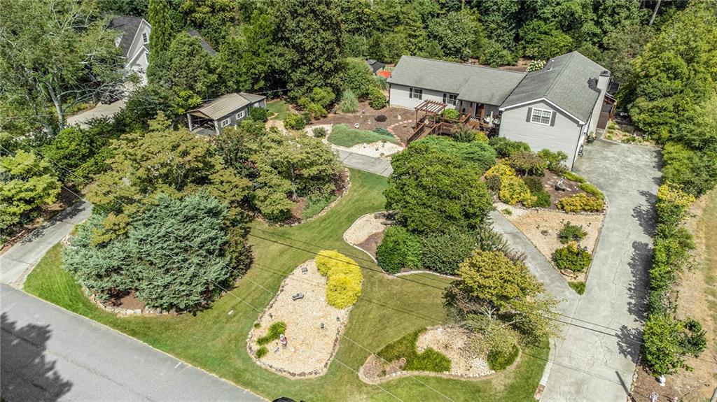 6228 Lively Way Cumming, GA 30040 - Photo 1 of 1 an aerial view of a house with a swimming pool