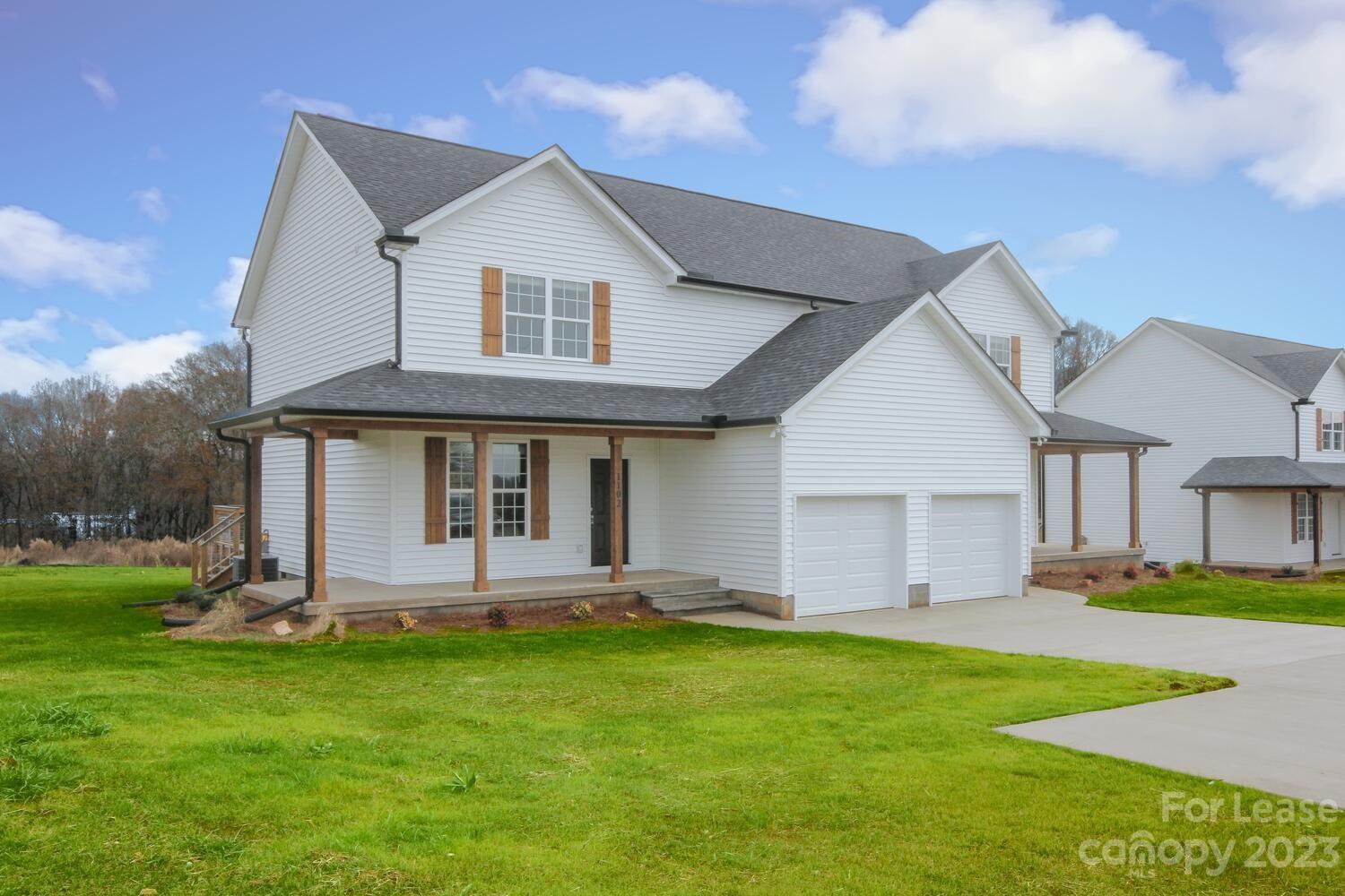 1084 Startown Road Lincolnton, NC 28092 - Photo 2 of 48 a front view of a house with a yard and porch