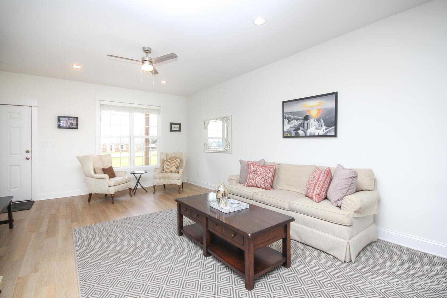 1084 Startown Road Lincolnton, NC 28092 - Photo 8 of 48 a living room with furniture and white walls