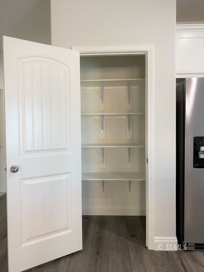 1517 Mayo Street Ridgecrest, CA 93555 - Photo 8 of 32 a view of walk in closet with empty racks