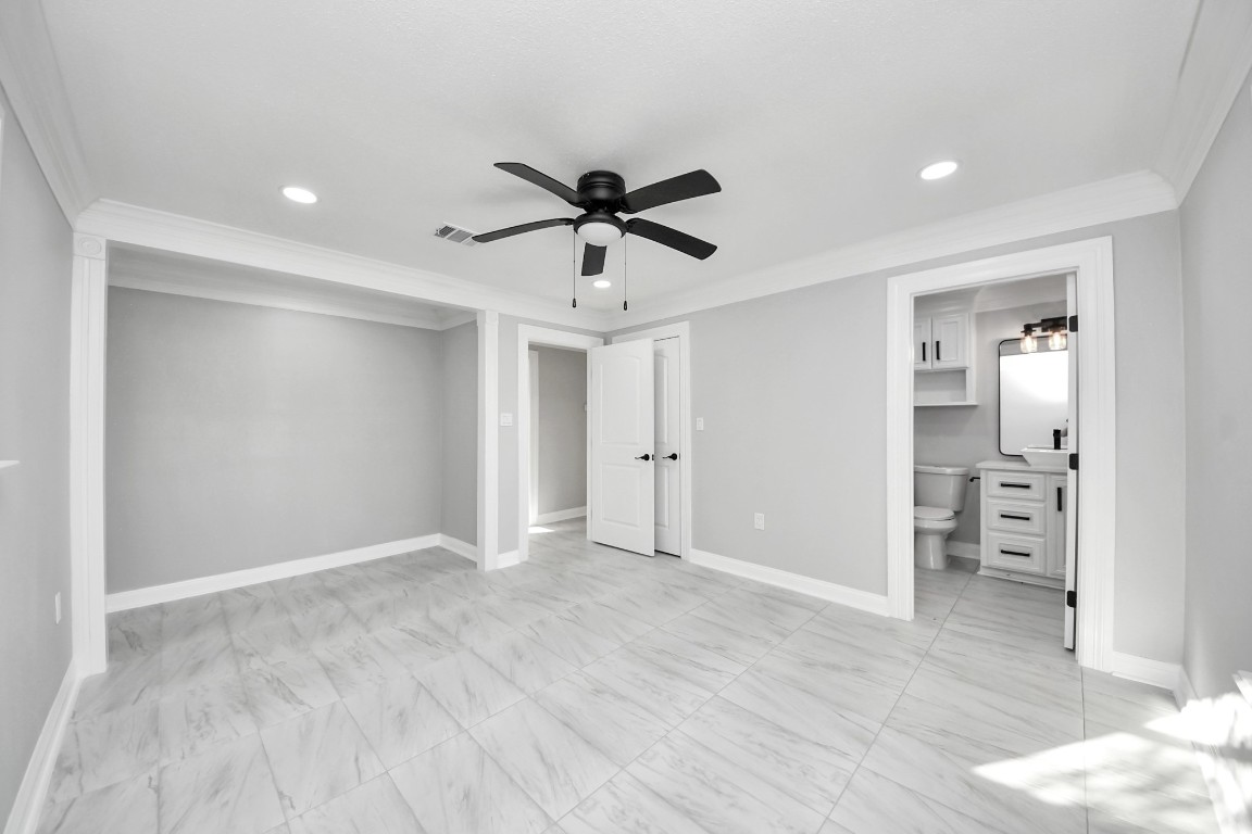16121 Palm Street Channelview, TX 77530 - Photo 20 of 26 an empty room with closet and a ceiling fan