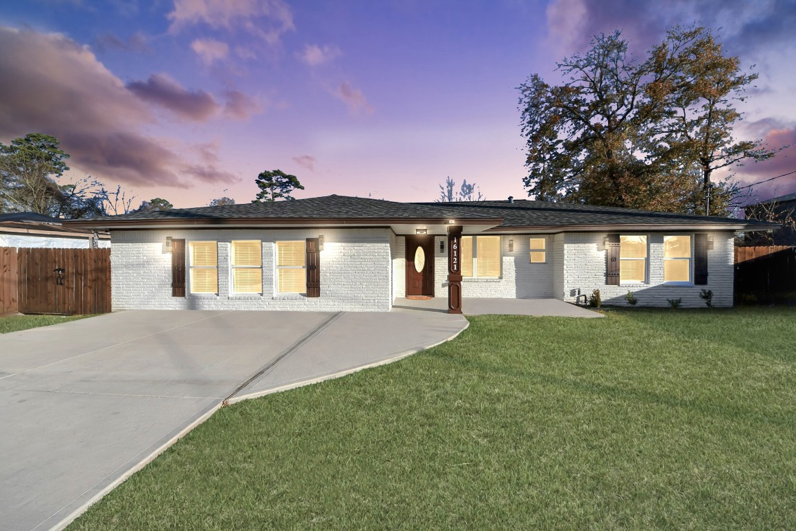 16121 Palm Street Channelview, TX 77530 - Photo 26 of 26 a front view of a house with a garden and yard