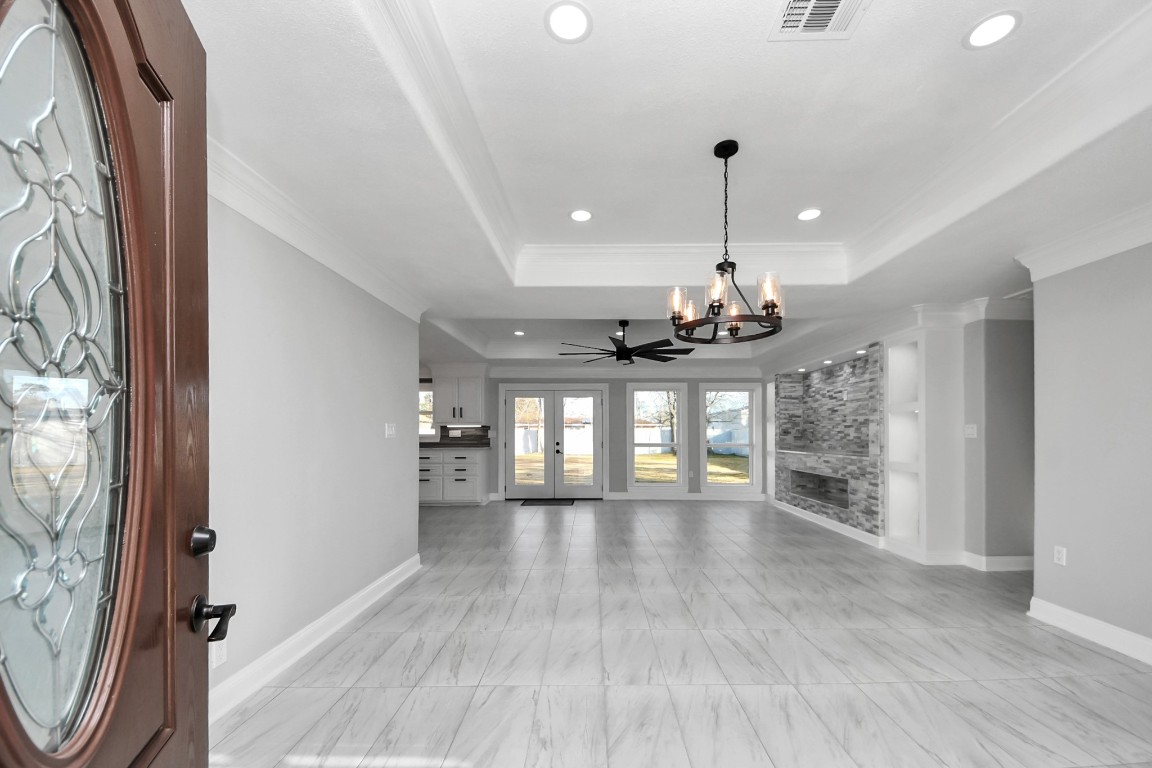 16121 Palm Street Channelview, TX 77530 - Photo 4 of 26 a view of a room with wooden floor and windows